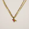Collier Arte fact doré à l'or fin et oiseau émaillé.