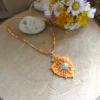 Pendentif Hypnochic orange brodé à la main – Image 2